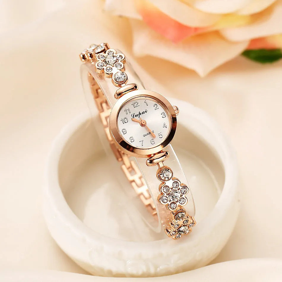 Ladies flower bracelet watch with round dial and silicone strap in gold colour