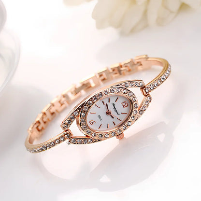 Silver-toned women's quartz bracelet watch with 25mm round dial, 185mm strap, and slim 7mm case for everyday wear