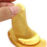 Gold crystal collagen eye patches applied under eyes for dark circle and fine line treatment