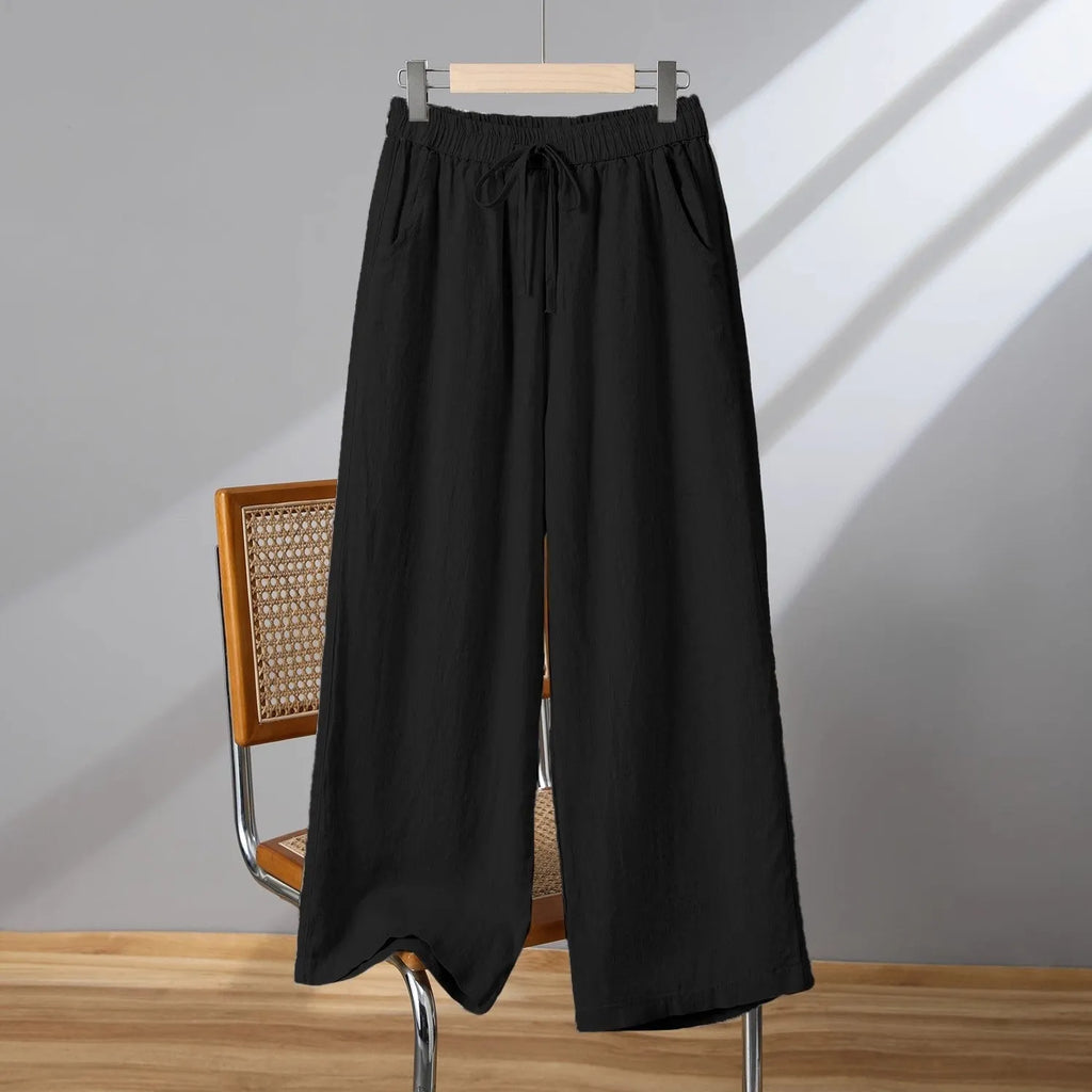 Women's straight-leg casual trousers with elastic drawstring waist in apricot colour.