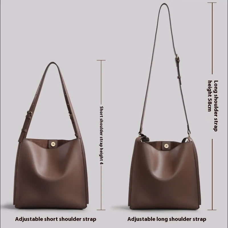 Brown genuine leather women's bucket handbag with double shoulder straps and interior organisation pockets