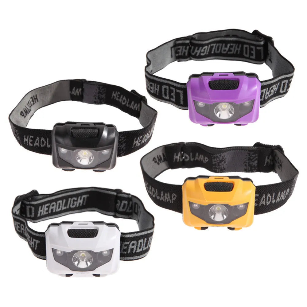 Black waterproof head torch with white and red LEDs, worn on head strap for outdoor activities.