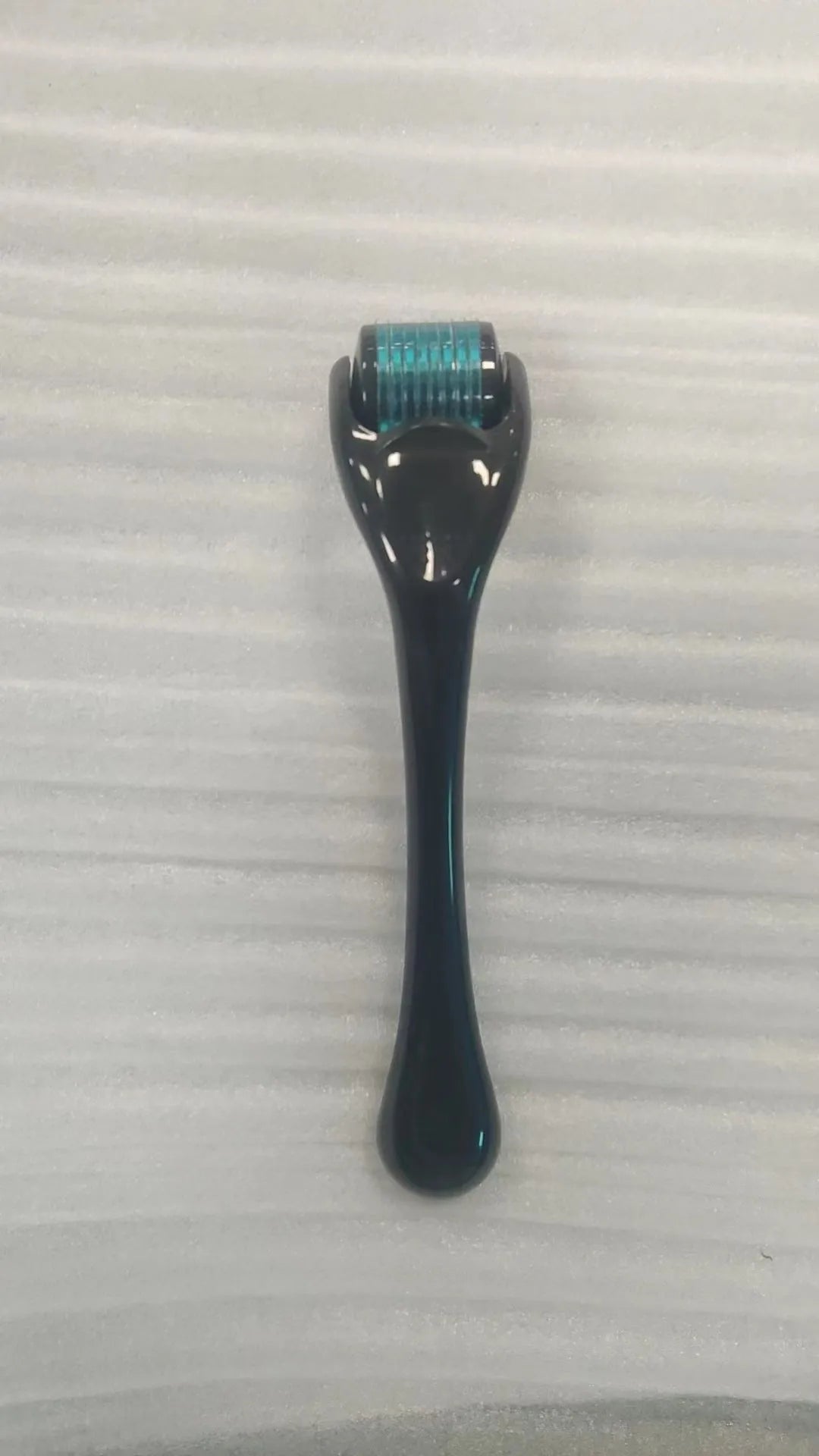540 needle microneedle derma roller with colour wheel on black handle, showing 0.25mm specification.