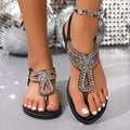 Women's bohemian sandals with rhinestone details on blue PVC upper and rubber sole.