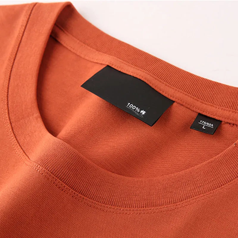 Men's solid colour cotton T-shirt with round neck and drop-shoulder sleeves