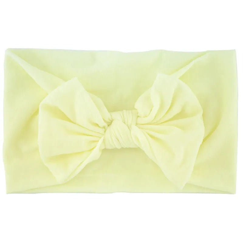 Super stretchy soft knot headband with bow for baby girls in 22 colours, made from nylon and spandex