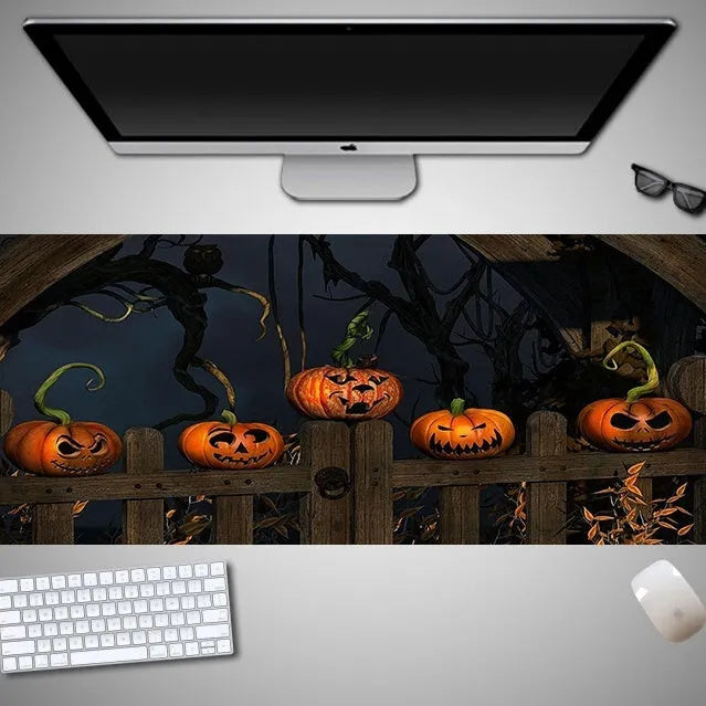 Oversized Halloween themed gaming mouse pad with non-slip rubber cloth base on a desk