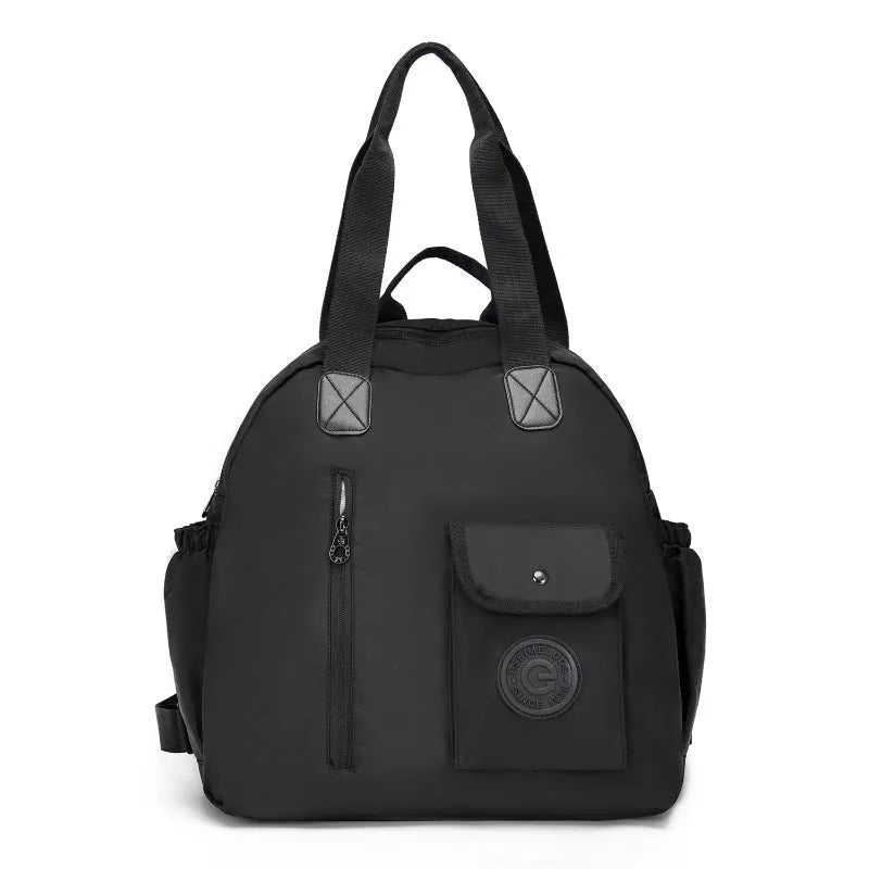 Large lightweight nylon backpack in khaki colour showing front sandwich pockets.