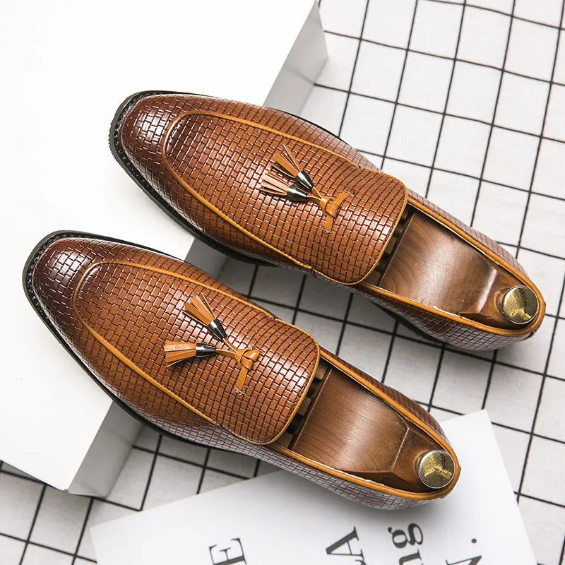 Men's black pointed slip-on shoes with tassel detail on a low-top PU upper