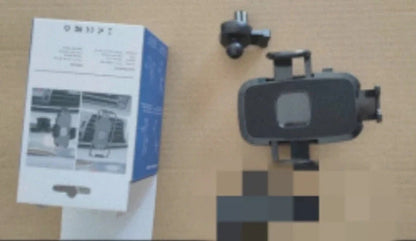 Gravity-activated car phone mount with enhanced suction cup attached to windshield holding smartphone