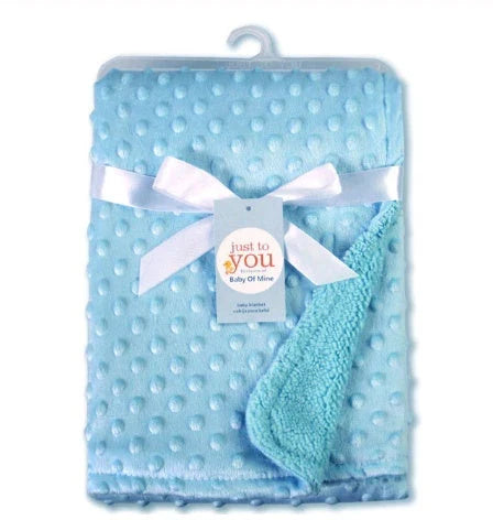 Soft and cozy baby blanket in various colors, including white, blue, gray, purple, green, and pink, with a plush, short-pile fabric and luxurious lamb velvet backing