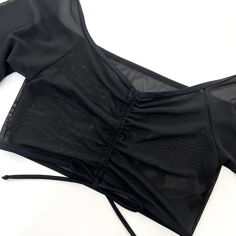 Black women's four-piece bikini swimsuit set with long sleeves for swimming sports.