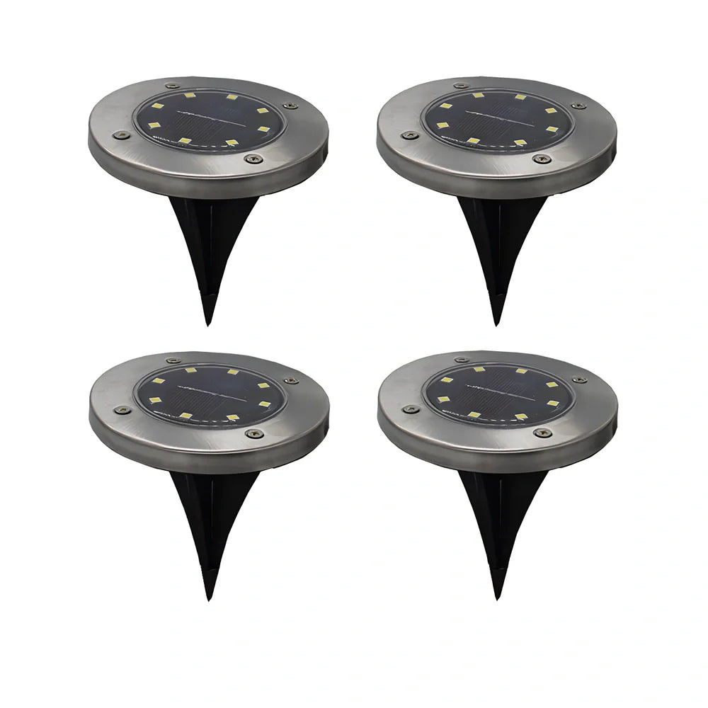 8LED waterproof solar garden light staked in lawn with warm glow, IP65 rated for rain resistance