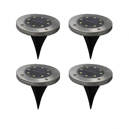 8LED waterproof solar garden light staked in lawn with warm glow, IP65 rated for rain resistance