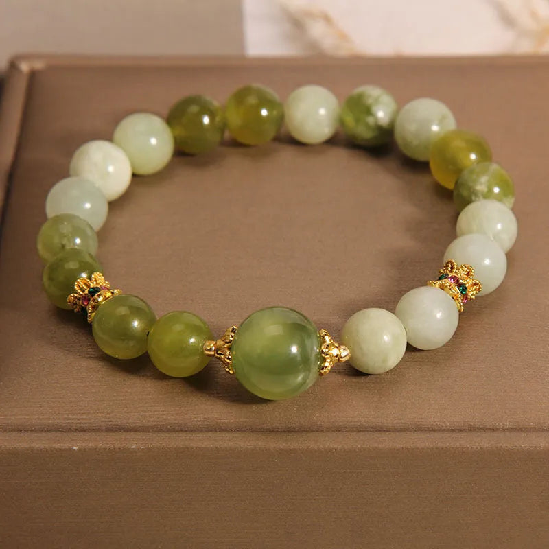 Original design women's bracelet with a green Xiuyan jade stone centrepiece.