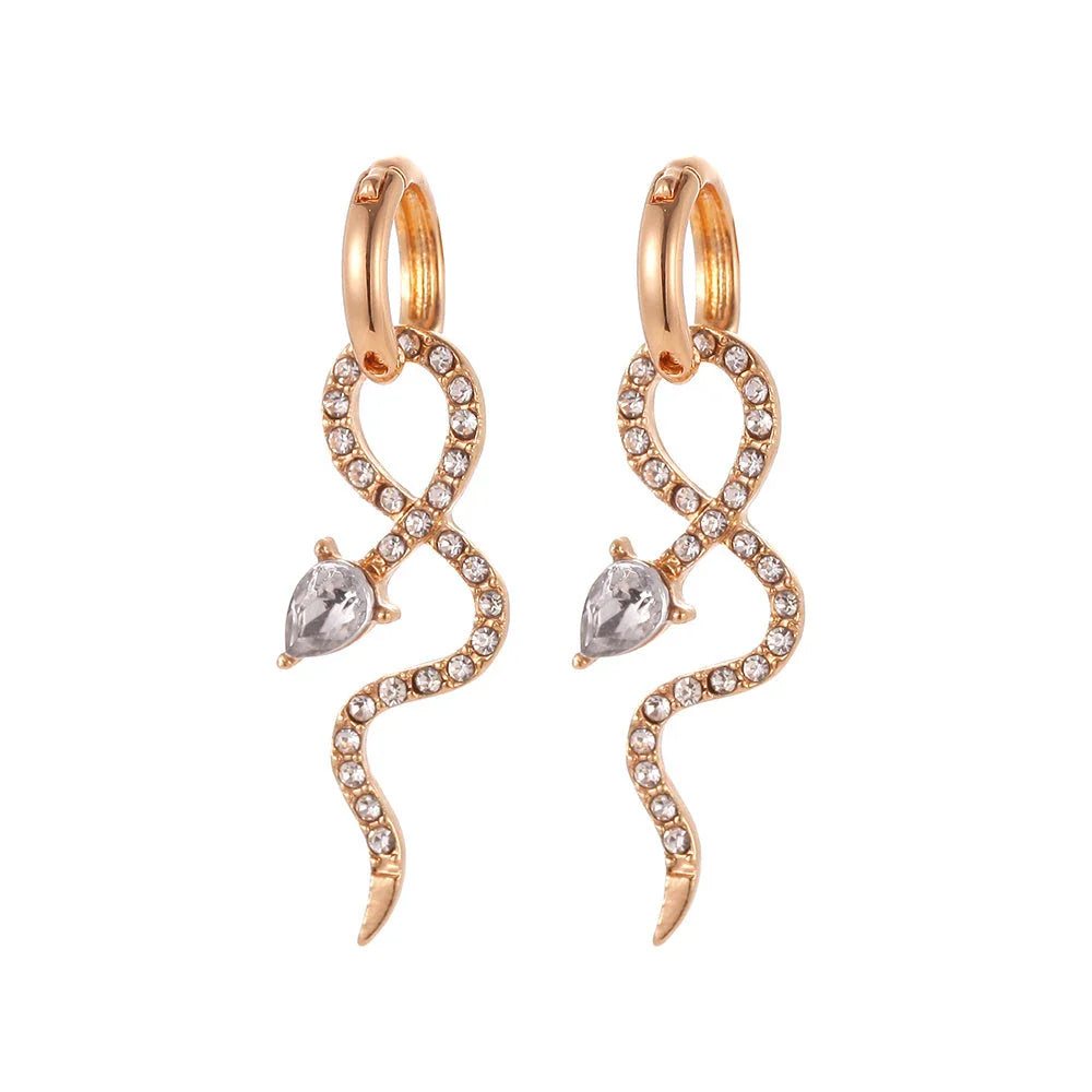 Elegant snake-shaped dangle earrings with a golden hue, showcasing a blend of European and American style