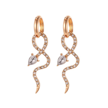 Elegant snake-shaped dangle earrings with a golden hue, showcasing a blend of European and American style