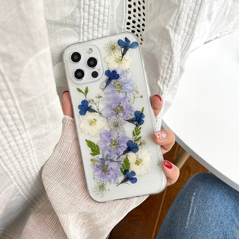 Soft TPU iPhone case with blue and purple dried flower basket design for multiple models.