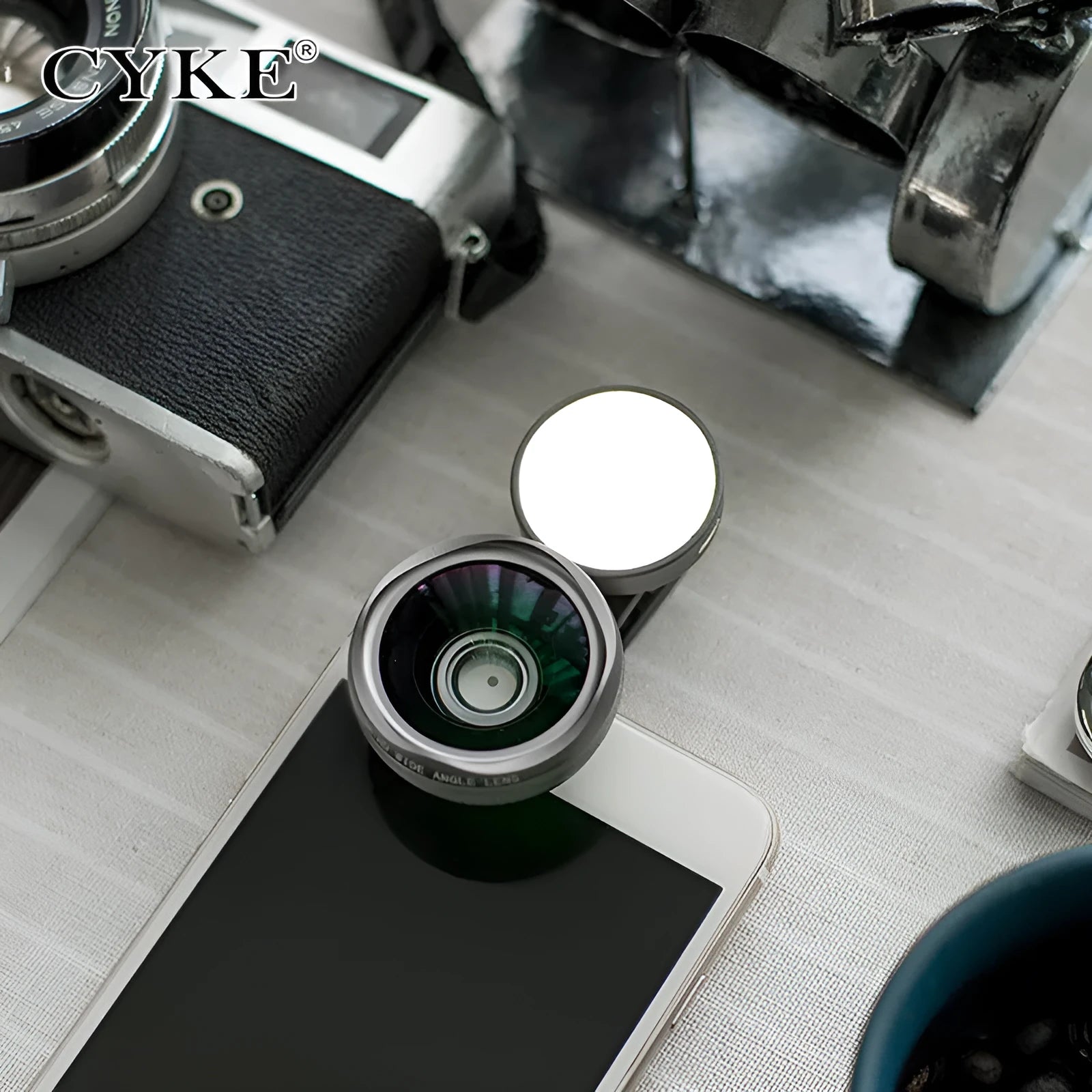 External smartphone camera lens with wide-angle capability and colourful LED lights attached to mobile phone