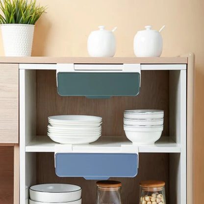 Under cabinet hanging storage box for kitchen utensils in white, green, and blue