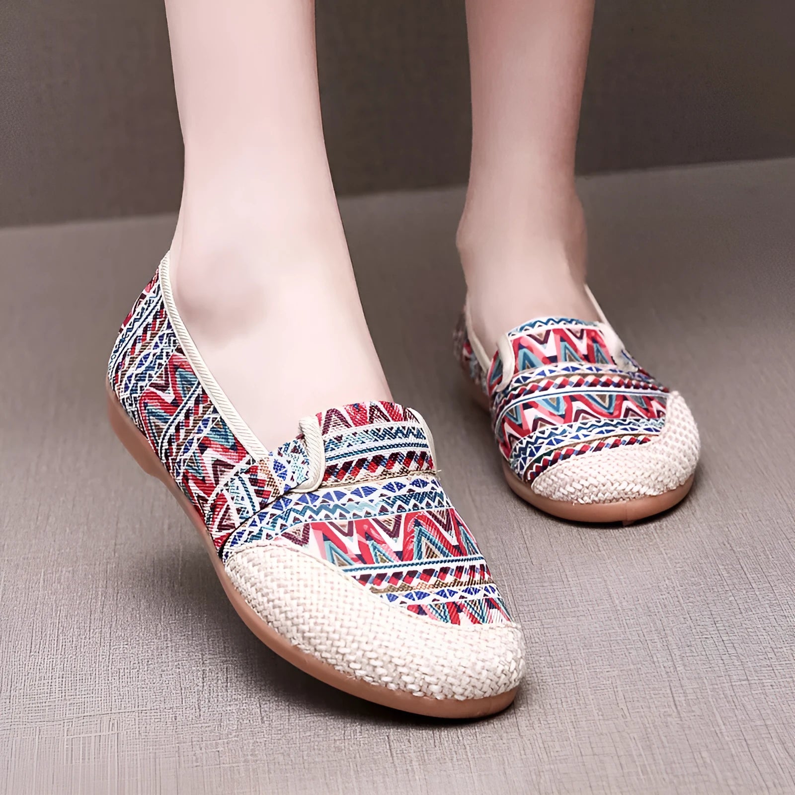 Women's flat heel ethnic cloth shoes in blue with colour stitching detail on a low-top, shallow mouth design.