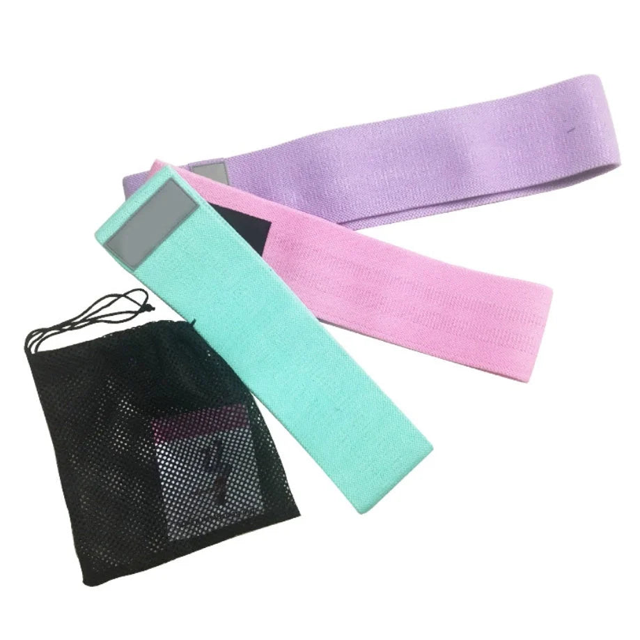 Latex mesh squat resistance band in lake blue, pink, and purple for hip and leg strengthening