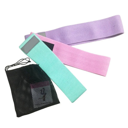 Latex mesh squat resistance band in lake blue, pink, and purple for hip and leg strengthening