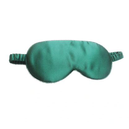 Silk double-sided eye mask in peacock blue and silver with adjustable strap, showing contoured nasal bridge design