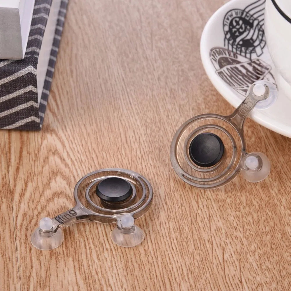 A pair of clear and black universal mini joysticks for mobile phone and tablet touch screen gaming.