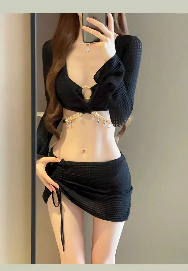 Women's long sleeve black and white bikini swimsuit with split bottoms for swimming
