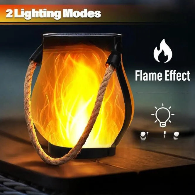 Flickering flame garden lamp with translucent shade in outdoor garden setting