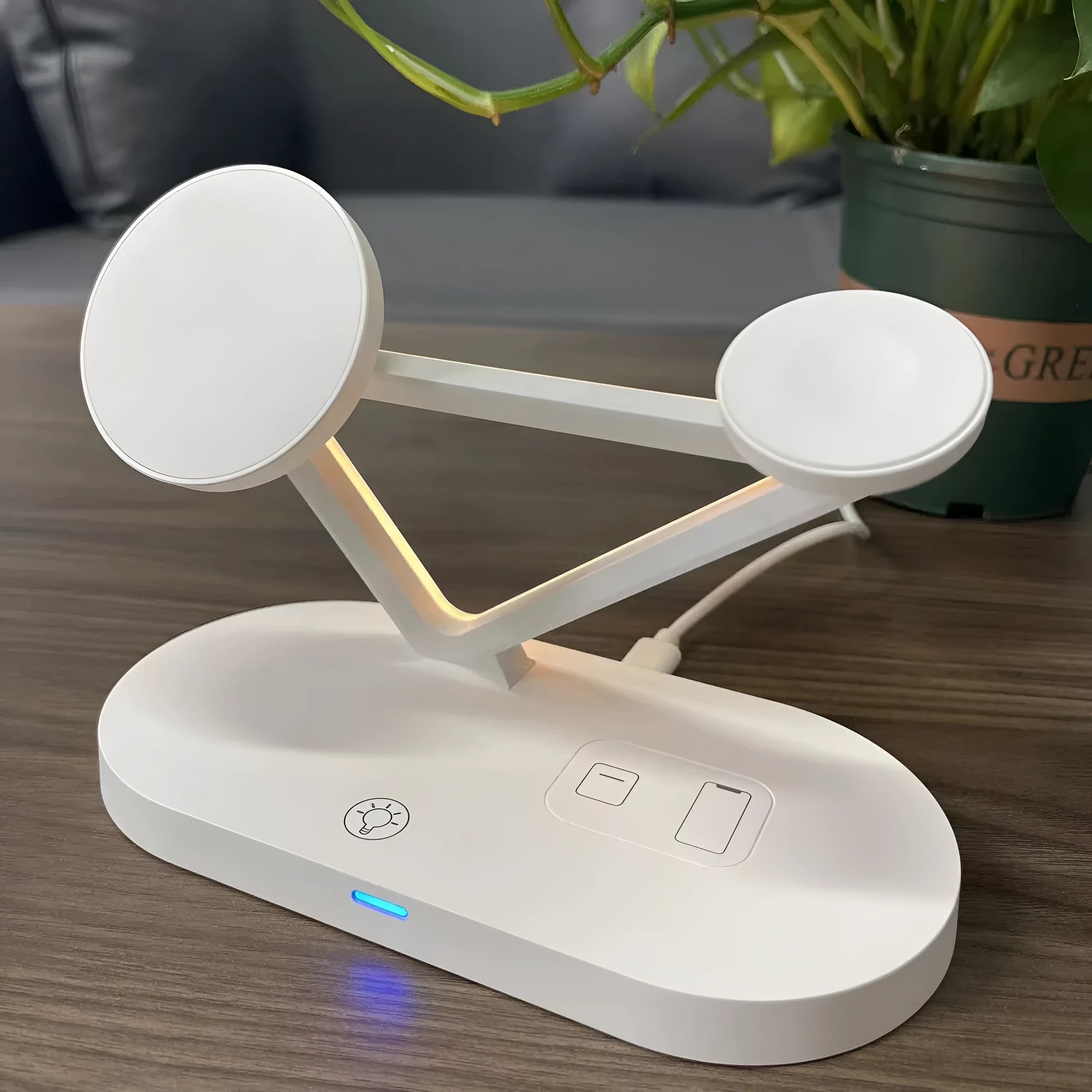 Black 3-in-1 wireless charging station for phone, Apple Watch and Airpods on a desk