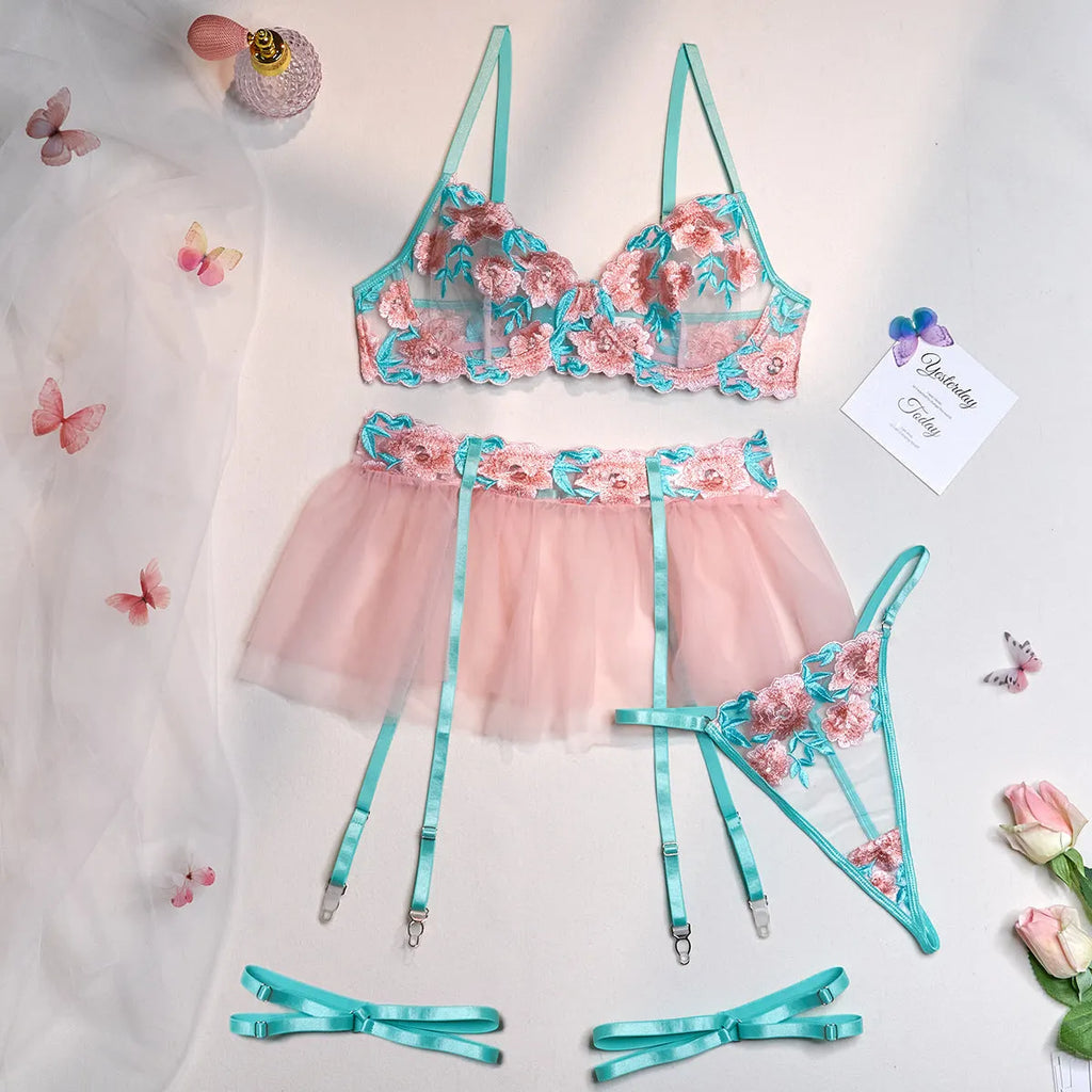 Pink women's bikini set with embroidery detail and a matching sheer mesh pettiskirt skirt.