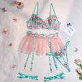 Pink women's bikini set with embroidery detail and a matching sheer mesh pettiskirt skirt.