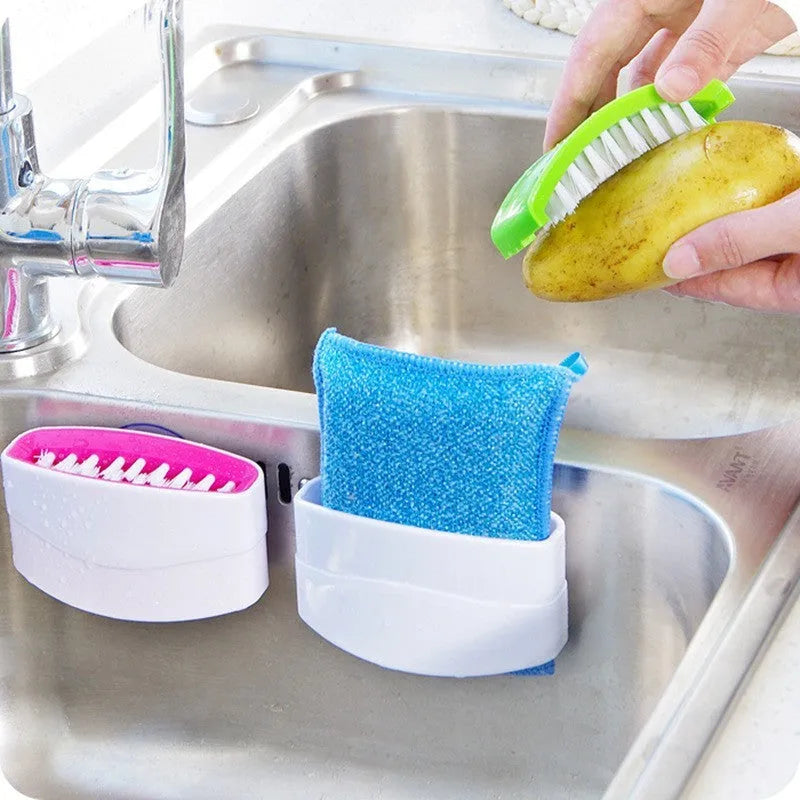 Blue kitchen cleaning brush with suction cup base for washing fruit, vegetables and cutlery.