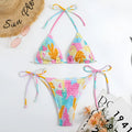 Women's triangle bikini swimsuit with floral gradient pattern and smocking craft detailing