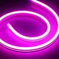 A 100-metre reel of flexible blue LED neon strip light showing its bendable silicone construction and bright illumination.