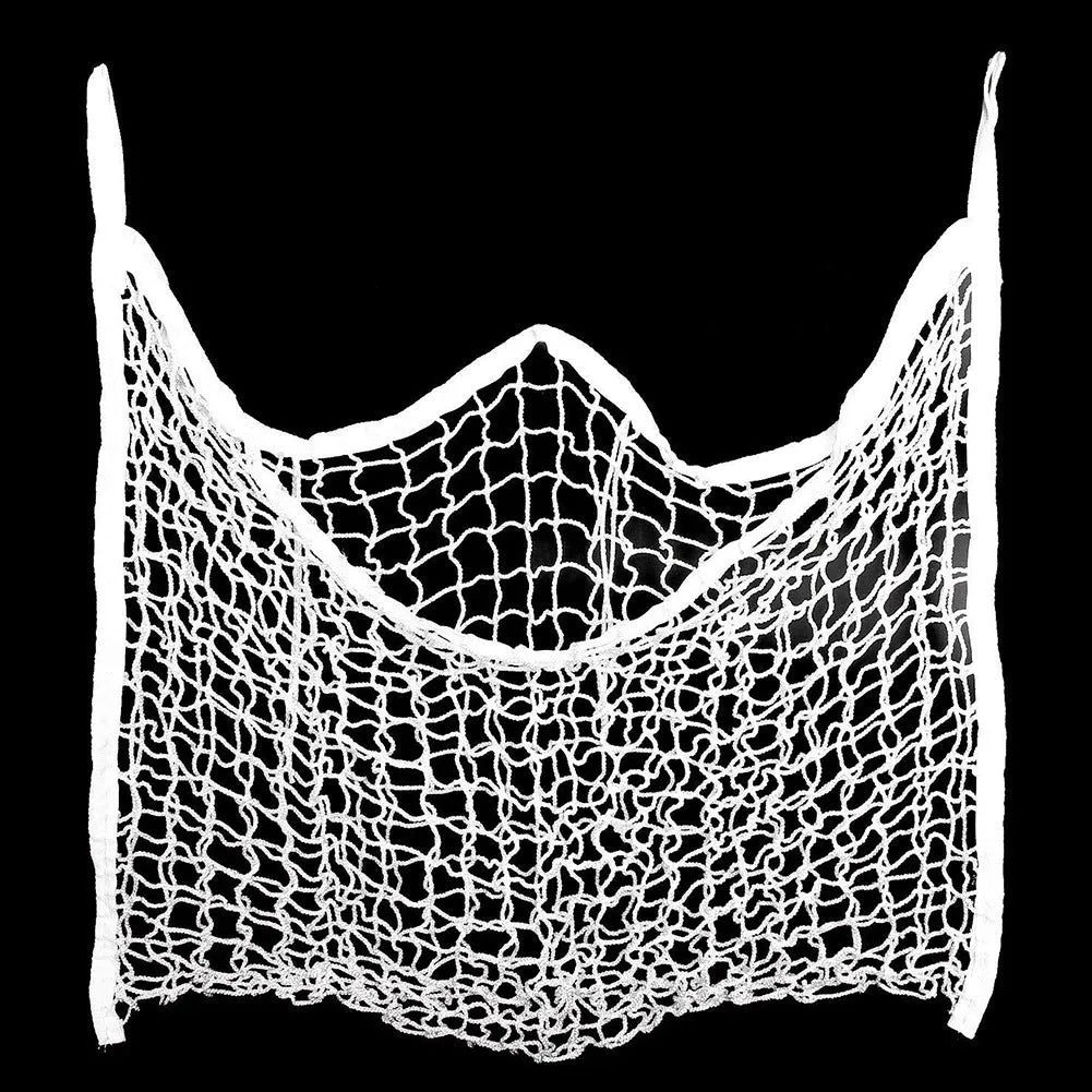Black woven grid horse feeding bag hanging on a fence