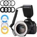 Traveller RF-550D macro ring flash with 48 LEDs, LCD display, and eight adapter rings 49-77mm on black background