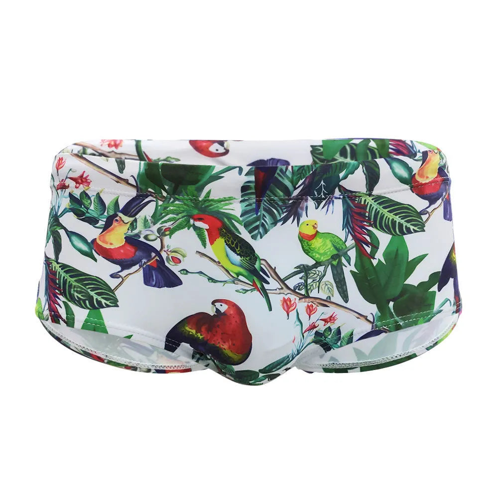 Men's floral bird print swim trunks with cup compartment in blue and white design