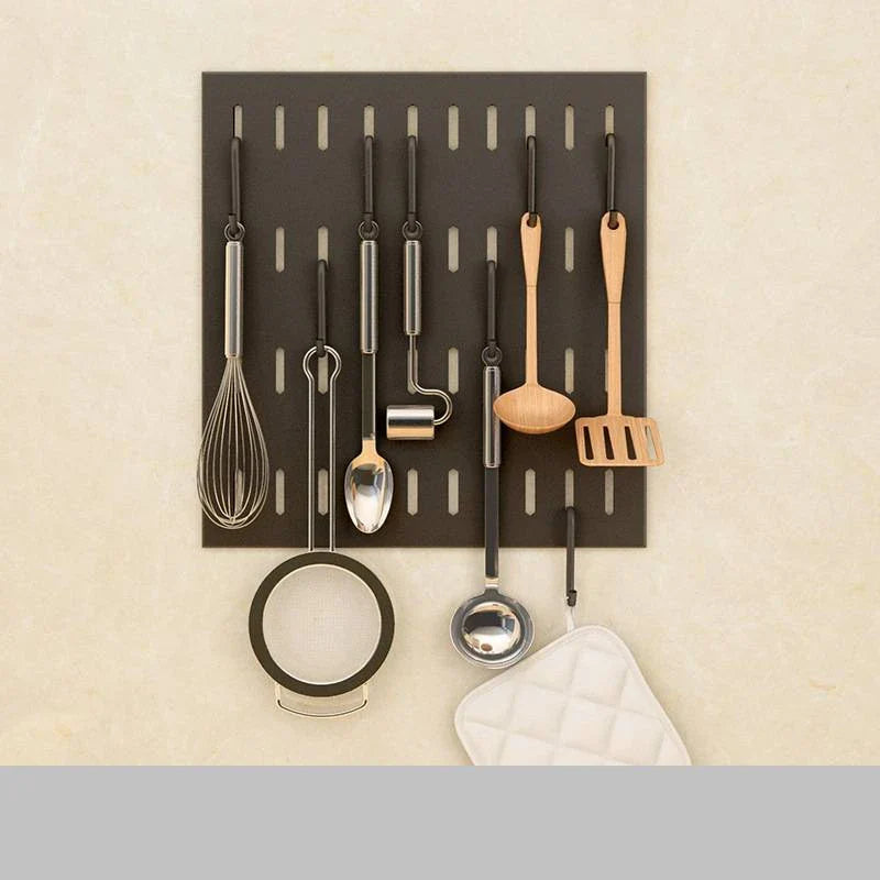 Wall-mounted stainless steel kitchen organiser with multiple storage compartments and hooks