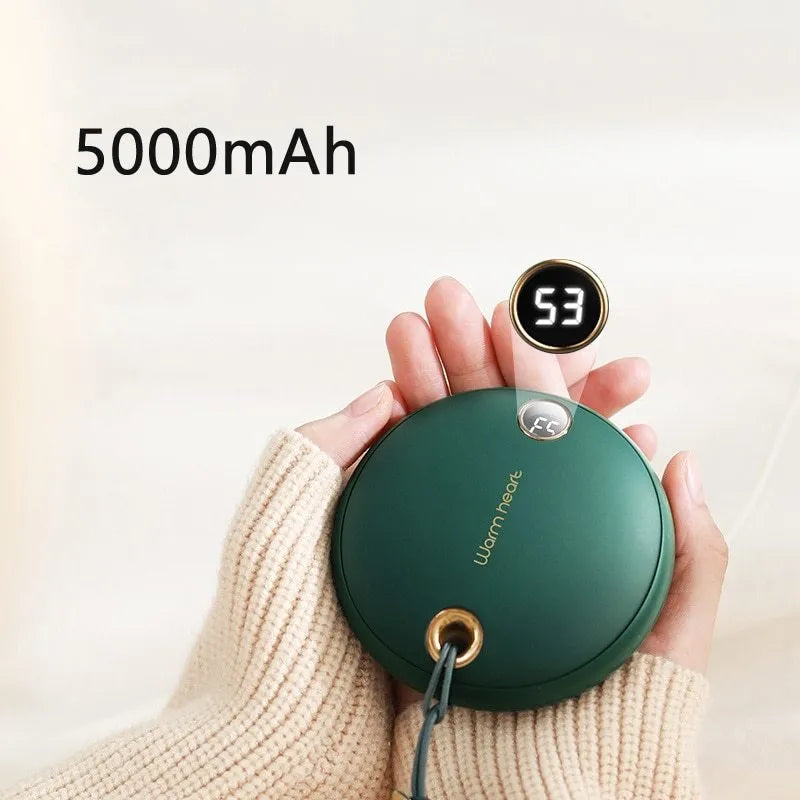 Green hand warmer power bank with digital display showing battery percentage