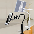 Flexible black mount holder with suction cup holding a tablet at an angle.