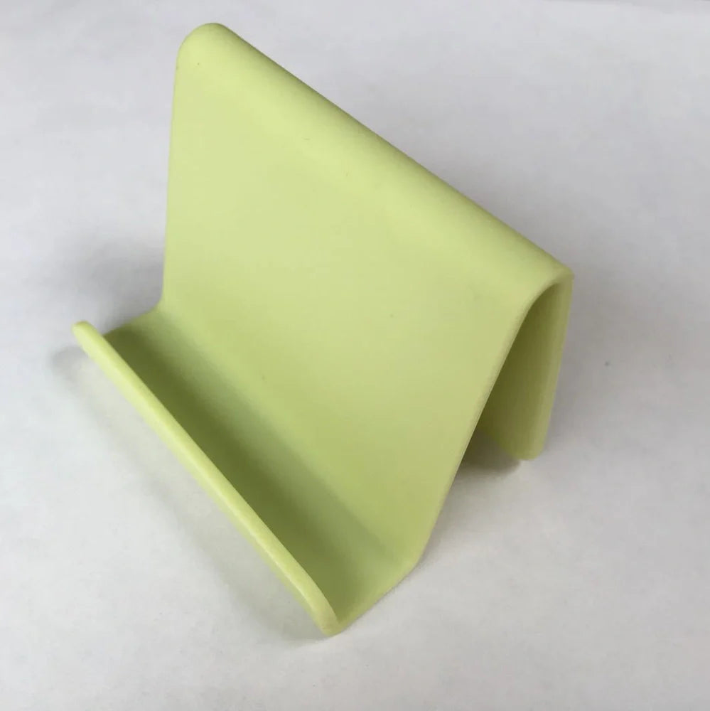 Candy colour plastic phone holder showing 6cm width and 4.5cm height dimensions
