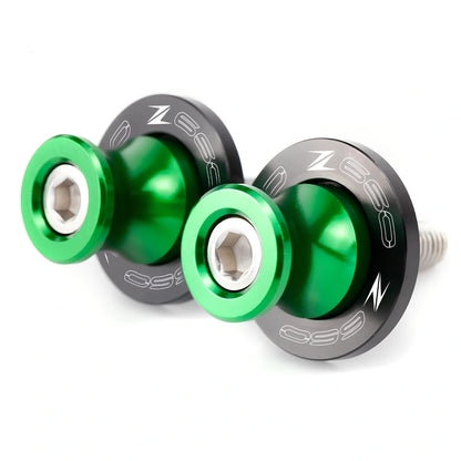 Pair of 8mm CNC aluminium swingarm spools sliders in titanium for Kawasaki Z650 Z900, with Delrin contact and stainless bolts