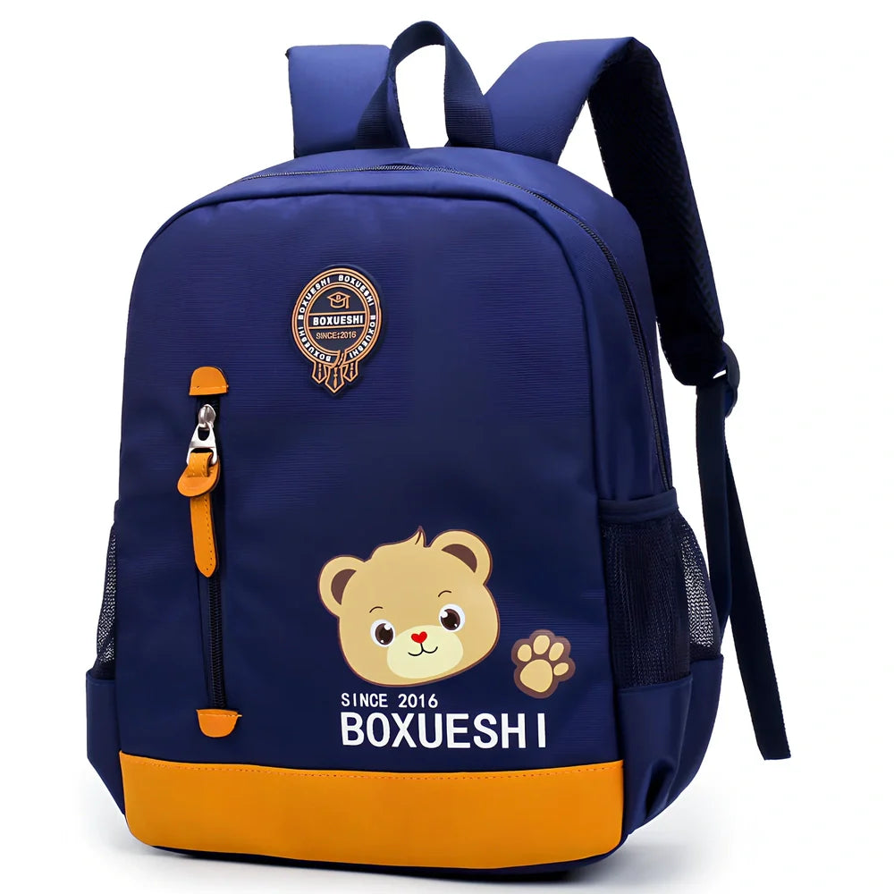Cartoon bear nursery schoolbag in deep blue or Mei red, 25 cm high with padded straps for boys
