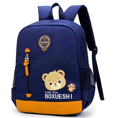 Cartoon bear nursery schoolbag in deep blue or Mei red, 25 cm high with padded straps for boys