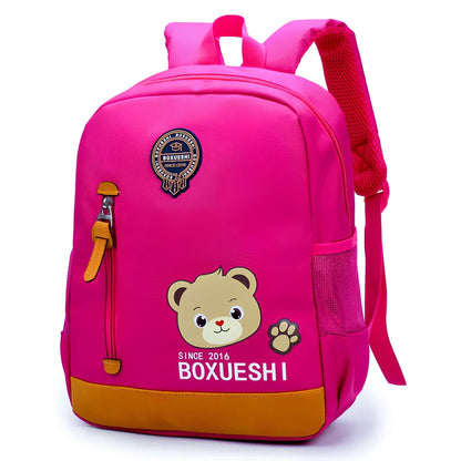 Cartoon bear nursery schoolbag in deep blue or Mei red, 25 cm high with padded straps for boys