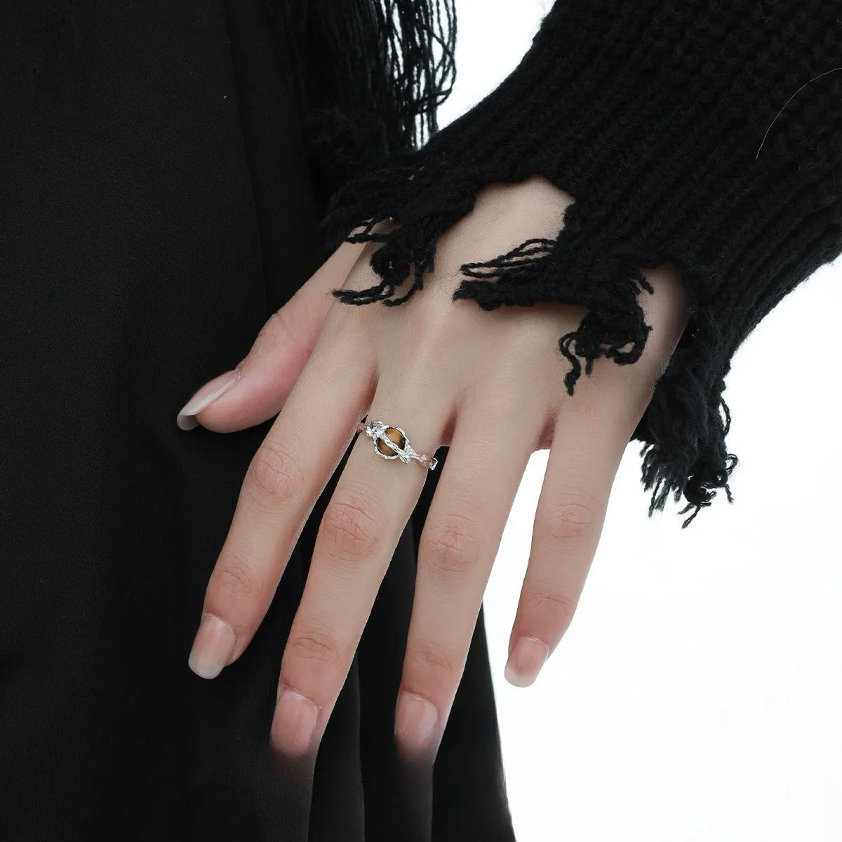 White gold colour Saturn open ring with adjustable opening on silver background