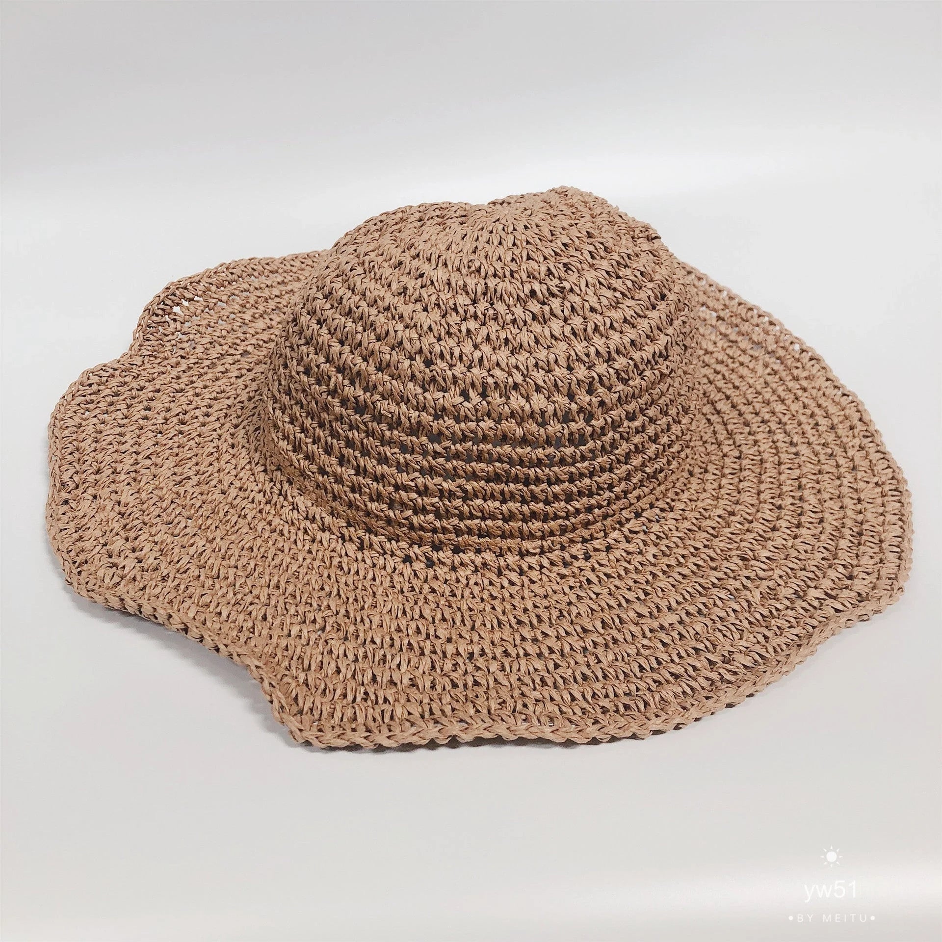 Women's foldable straw sun hat with wide brim for summer sun protection